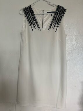 White House Black Market  cream colored dress with black sequin details